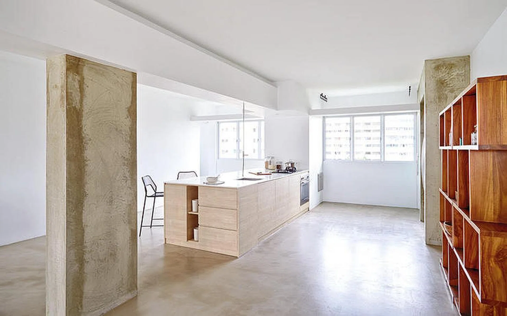 A large island was essential to anchor the wide kitchen area, which was where the former kitchen and bedroom used to be.