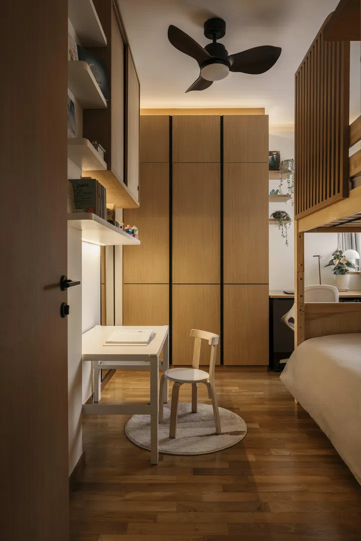 Designed to adapt as her children grow, their bedrooms combine modular bunk beds with integrated storage and soft, rounded details.