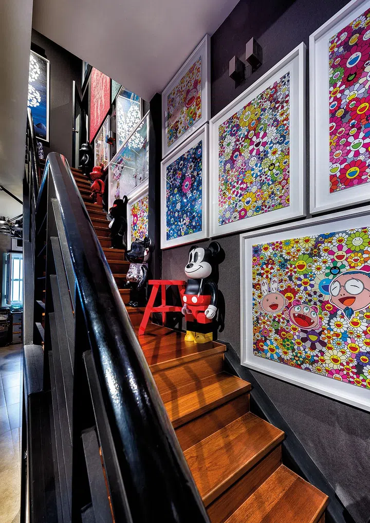Hung all along the staircase, the eye-popping work of Takashi Murakami commands attention.