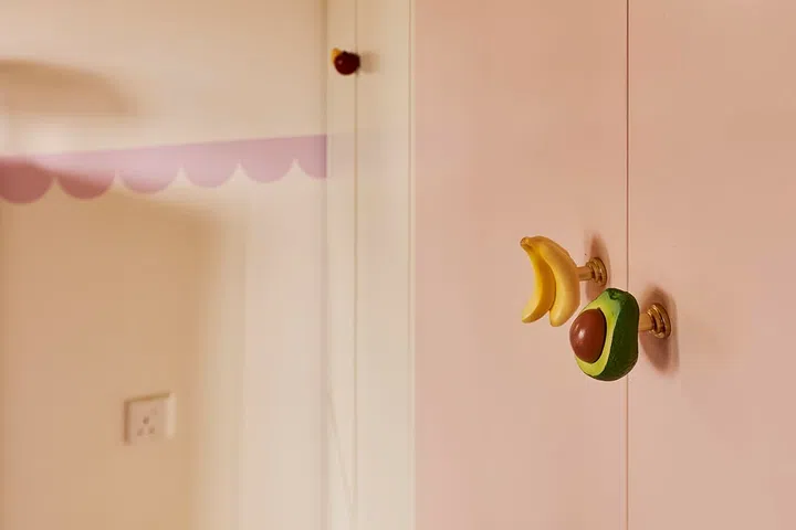 Whimsical fruit-shaped handles add a joyful touch.