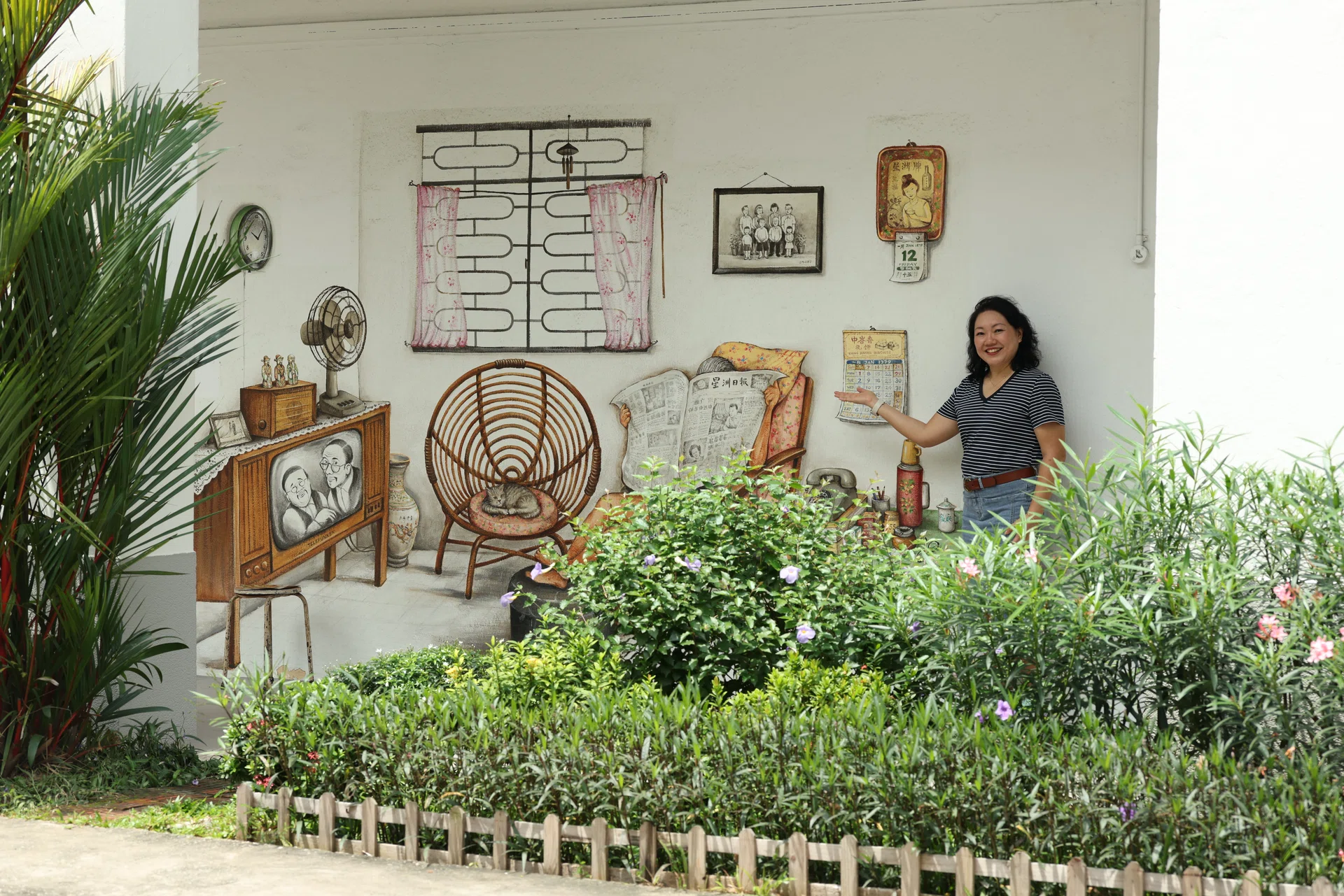 Homeowner Jess showing us one of the two main murals in the Tiong Bahru neighbourhood.