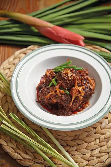 Oxtail Asam Pedas in a stylised white bowl - recipe