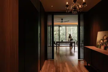 The homeowners of this six-bedroom apartment envisioned a mid-century modern treehouse, a home that felt intuitively grounded in nature yet quietly refined.