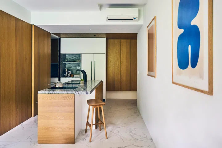 An island in the dry kitchen for mingling over drinks and preparing food.