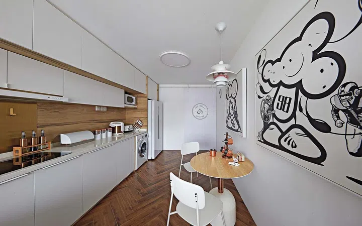 Wood-like laminate flooring for a kitchen. Interior design by Calvin Ho