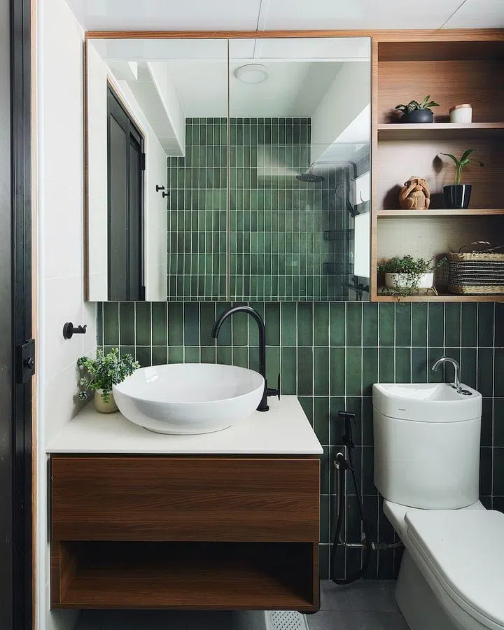 For visual continuity, deep green tiles were used in the master bathroom, creating a soothing, earthy vibe with a touch of boutique-hotel luxe.