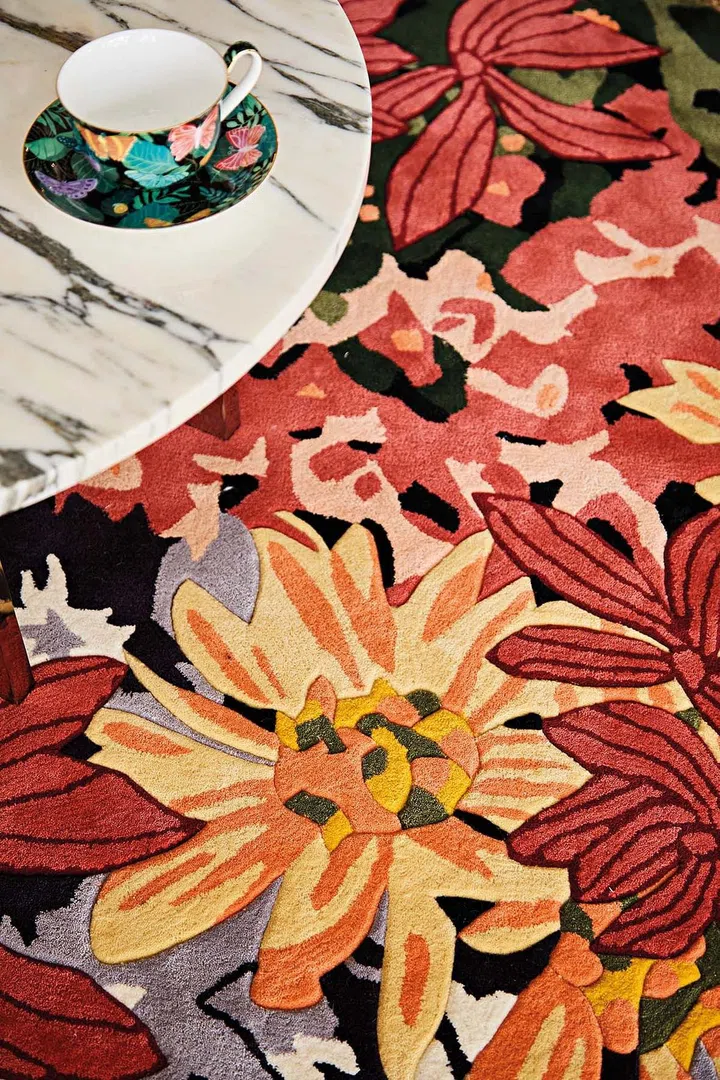 Bloom & Shrooms tea cups from T2 matches the floral carpet.