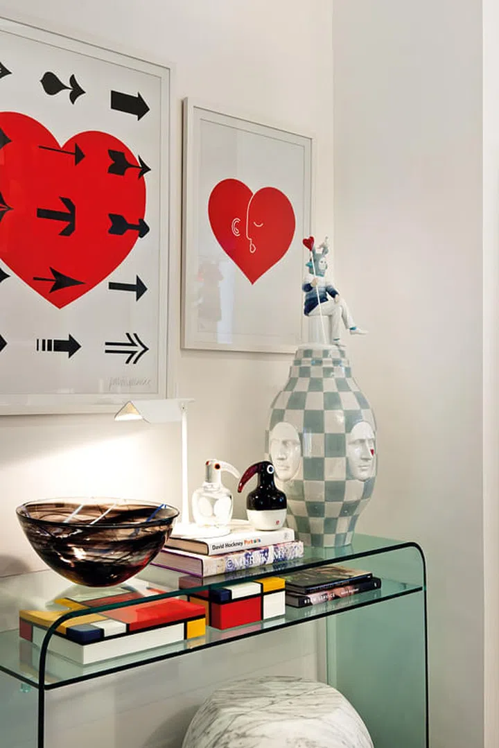 Grouping several accessories in a corner works if their patterns and shapes match - the end result is intimate, not crowded.