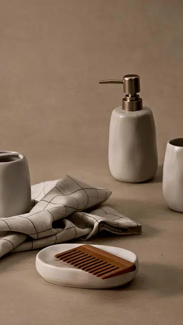 Beech hair comb, from Muji. Bathroom accessories set of four, from SSF home.