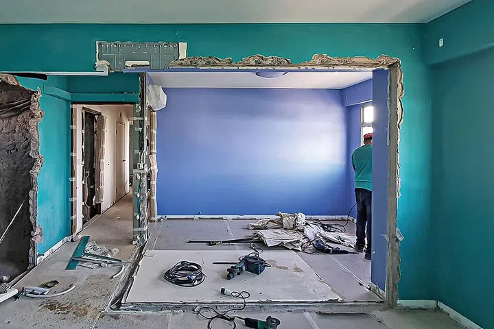 The bedroom before renovation, as hacking works were ongoing.