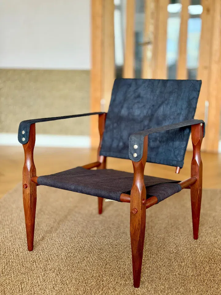 Second-hand: $1,060. Wilhelm Kienzle Safari Chair, Black Linen Mahogany Finish, 1950s from Etsy.