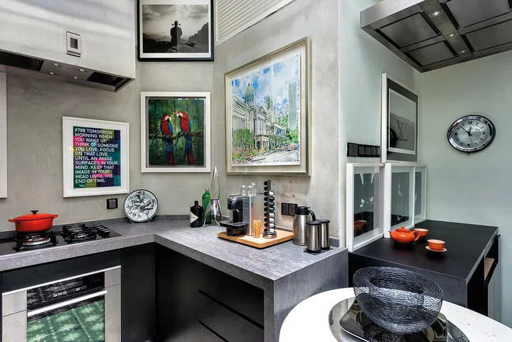 Sunshine enters through the skylight and floods the kitchen while the high ceiling provides ample vertical wallspace for more art.