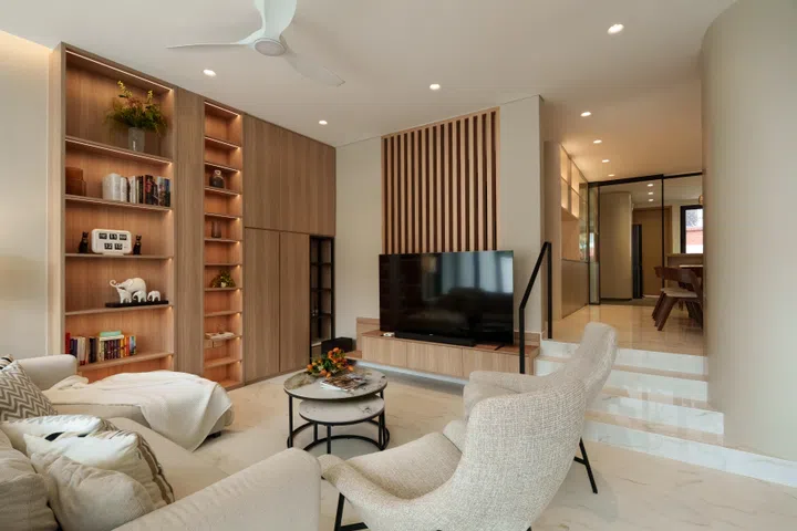Rather than flatten the original split-level layout at significant cost, YWA Studio worked with the home’s existing structure, using the change in level to gently separate the living and dining areas.