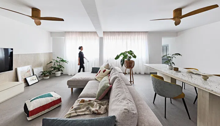 One bedroom was opened up to become part of the living room. The spacious living and dining areas are where Miss Chew spends most of her time at home.