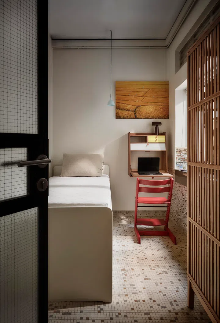 A compact second bedroom is designed for flexibility, accommodating work, rest, and long-held furniture that continues to adapt with family life.