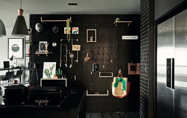 Design a versatile pegboard display wall. Interior Design: Millimeters Studio