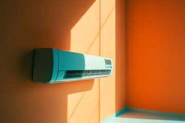 Air conditioner on the orange wall. 3d render illustration.