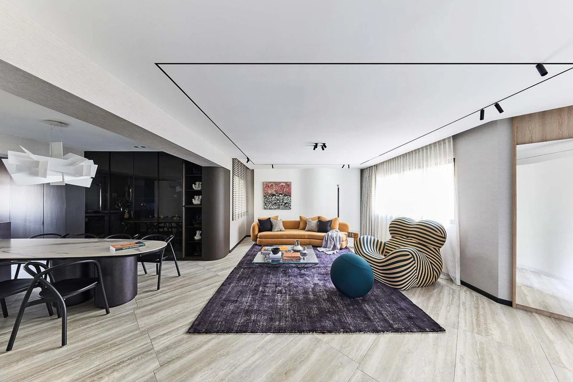 Living room containing an eye-catching La Mamma armchair and footstool from B&B Italia in this HDB executive apartment at Rivervale Plains.