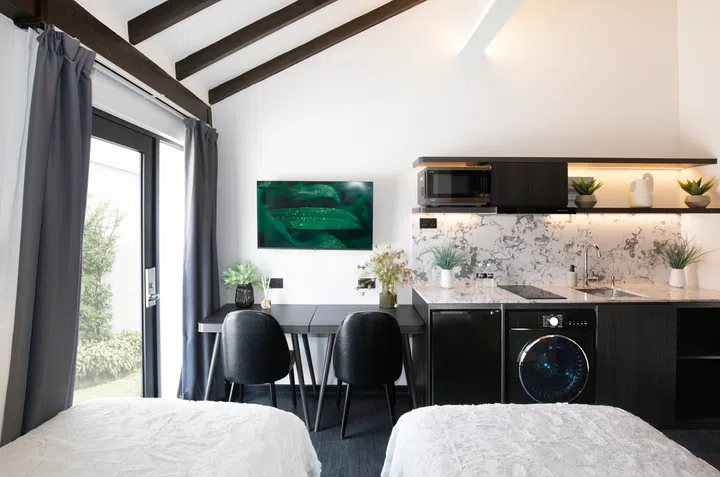 Inside a guest room in the Coliwoo Resort Changi coliving hotel.