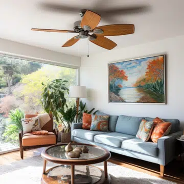 Interior of a living room with a blue sofa, coffee table and a painting on the wall