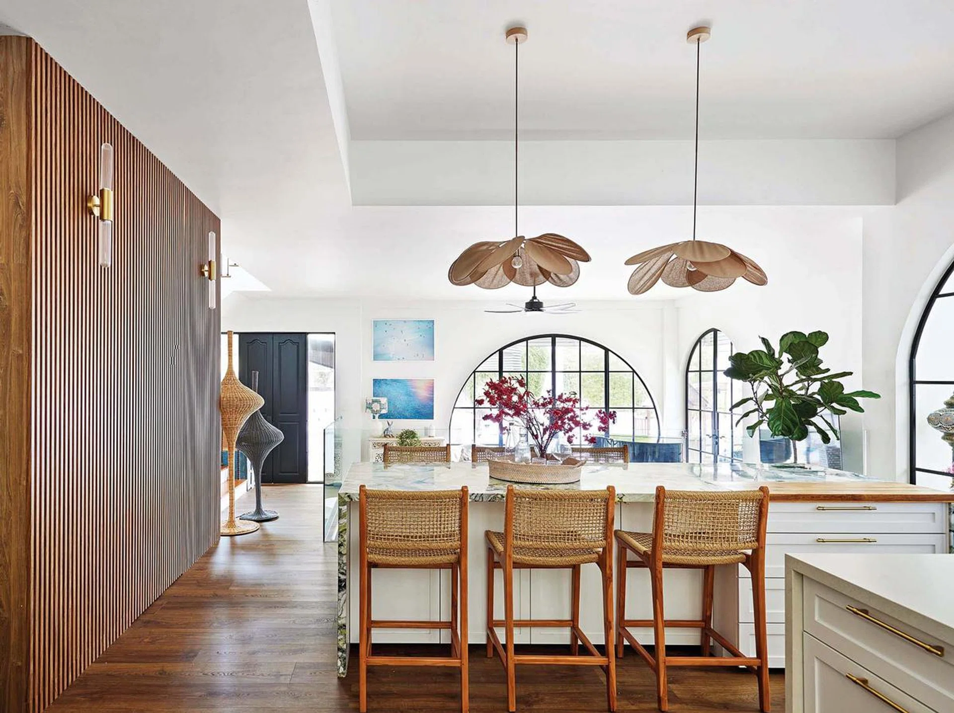High stools from Island Living and Lavavella brass handles bring the whole modern chic look together in the dry kitchen.