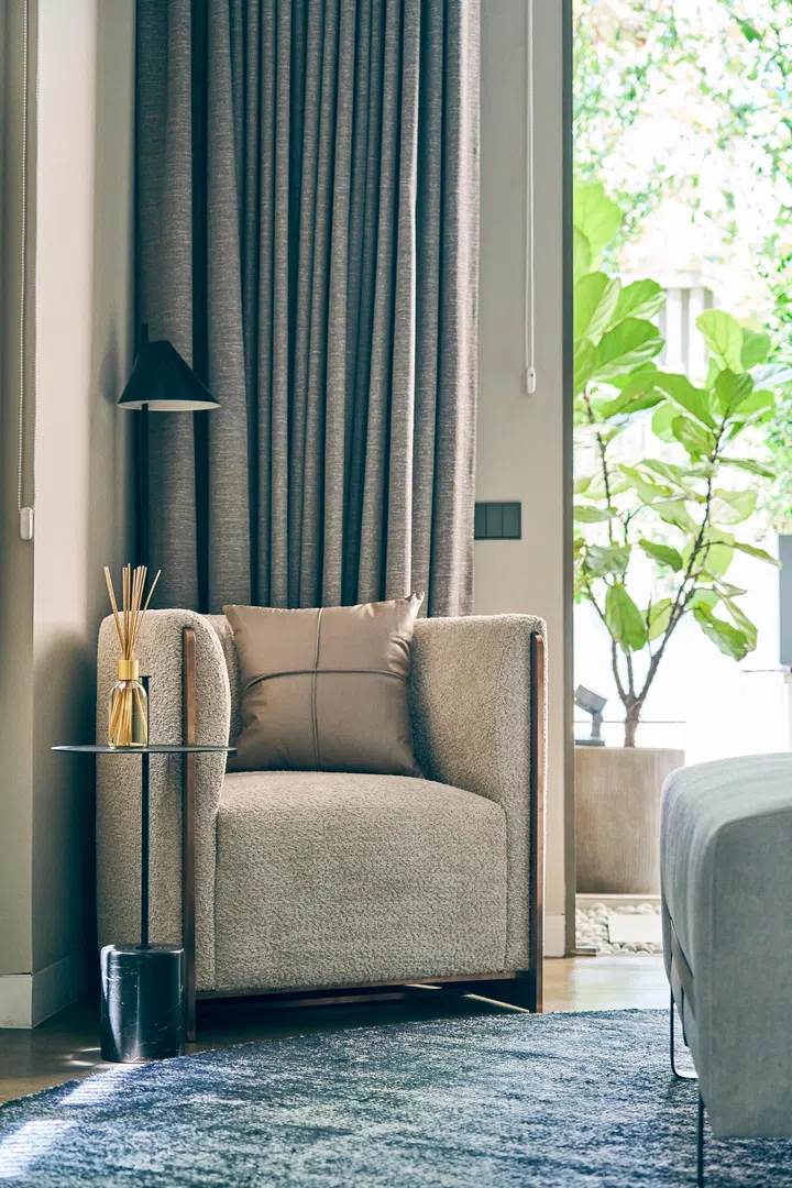  A quiet reading nook in the corner underscores the retreat-like quality of the master bedroom.
