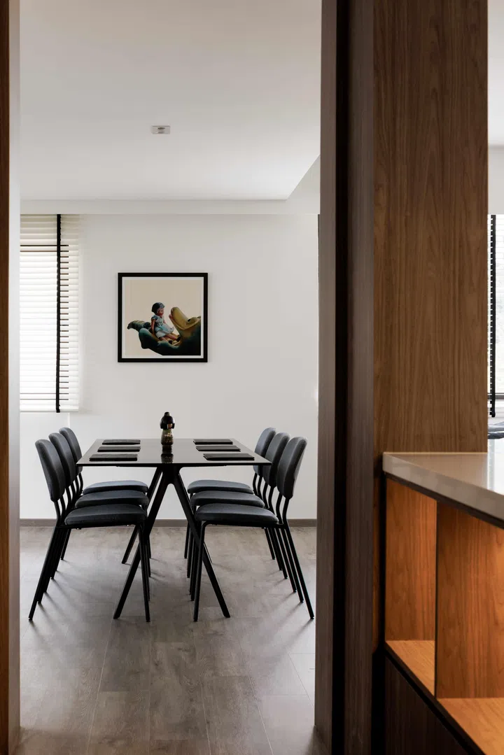 A six seater dining set anchors the dining room and reflects the family’s belief in connection through shared meals. 