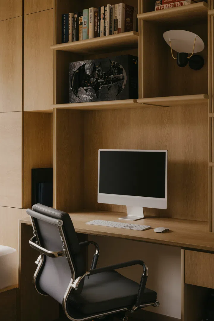 A Lego Batcave model tucked among books and personal objects supports the room’s nickname: Walter’s “Batcave”.