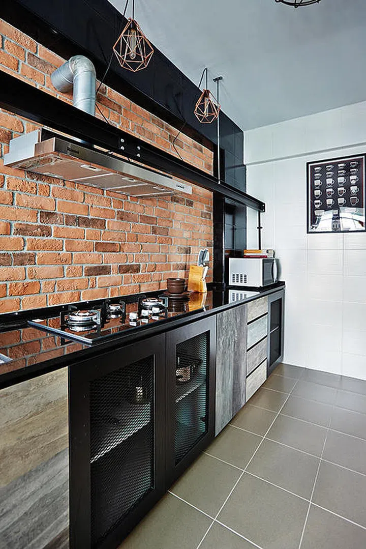 [Reno Cost: $55,000] Instead of a predictable brick-like feature wall in the living area, the couple installed a brick-like kitchen backsplash.