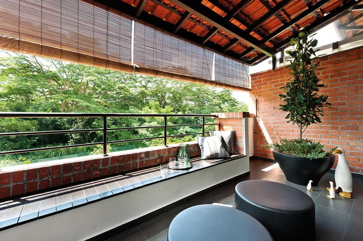 Greenery and generous seating lend this balcony its magic - it's perfect for unwinding alone, or for entertaining friends in the evenings.