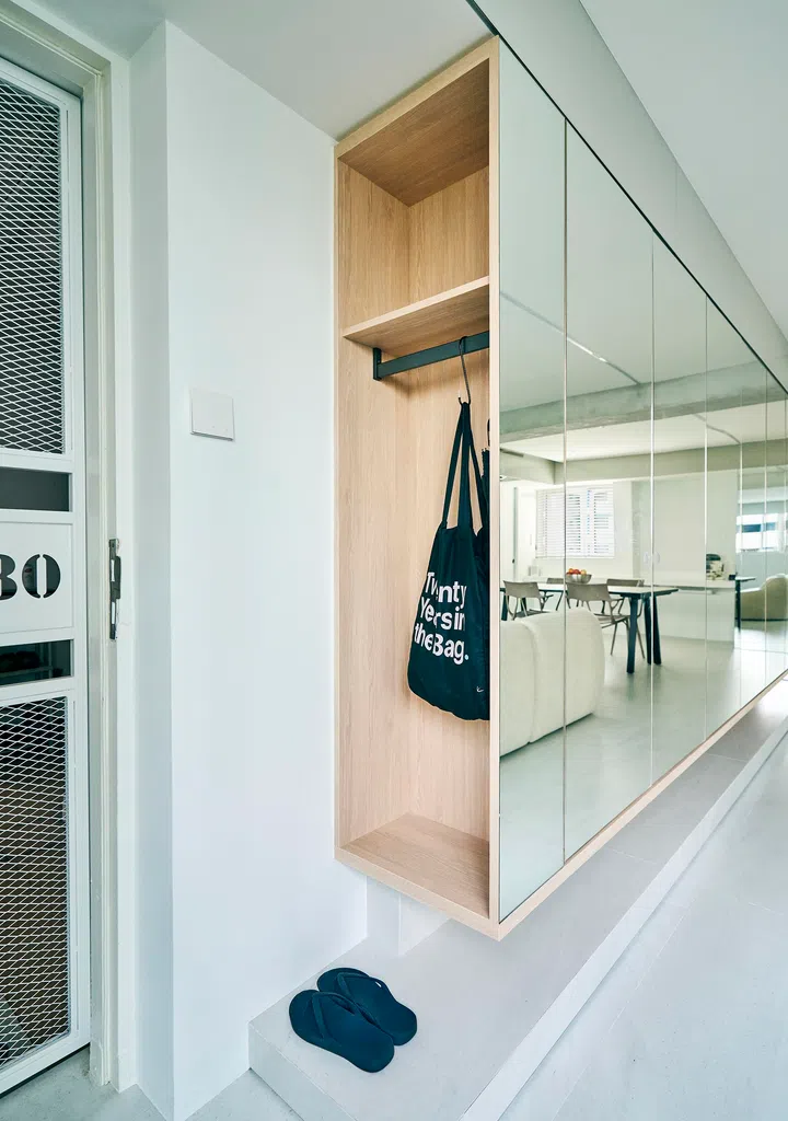 Mirror-covered storage cabinets disguise the family’s “extra stuff.” 
