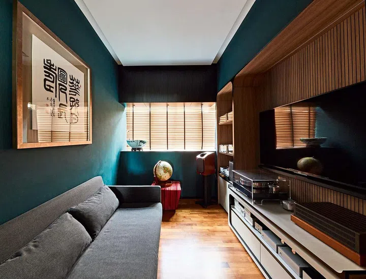 Fluted panels in the music room continue the wooden screen theme to ensure a seamless visual flow.