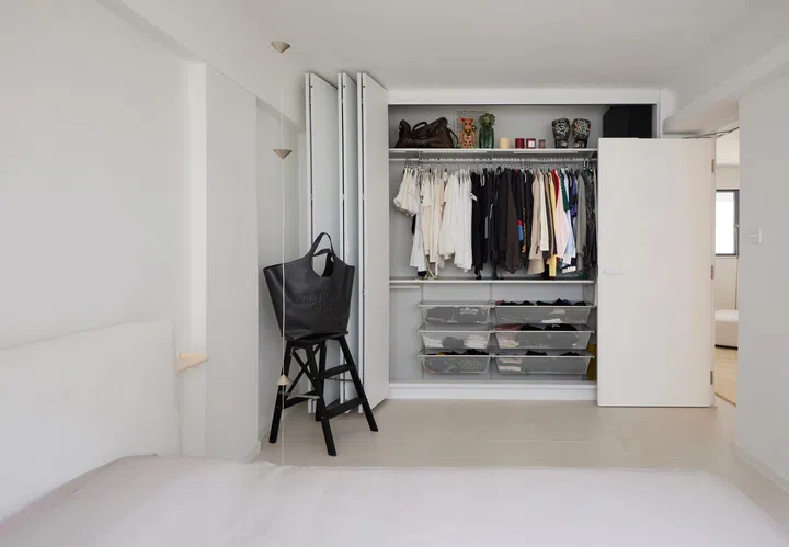 Behind a set of stacking doors lies the fashion stylist’s closet: a reflection of her personality and style. 