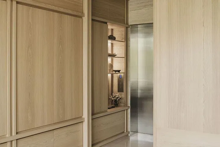 Storage space starts from the entrance foyer, concealed behind figured ash natural veneer doors. (Photo: Studio Periphery)