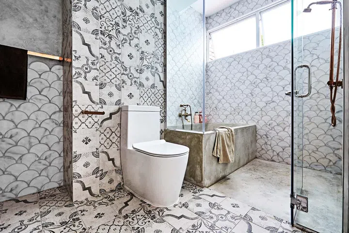 Each bathroom features interesting tiles from Hafary, from tropical prints in the guest bathroom downstairs to the pretty mother-of-pearl bricks in the daughter’s bathroom.