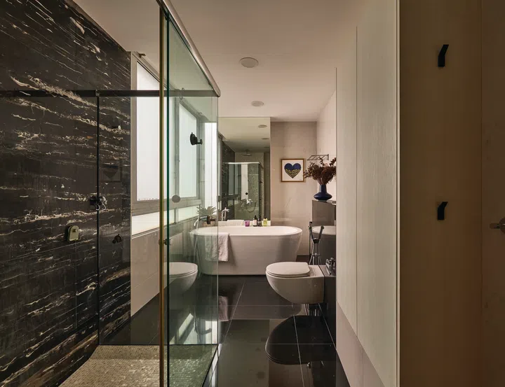 A freestanding bathtub sits in the master bathroom.