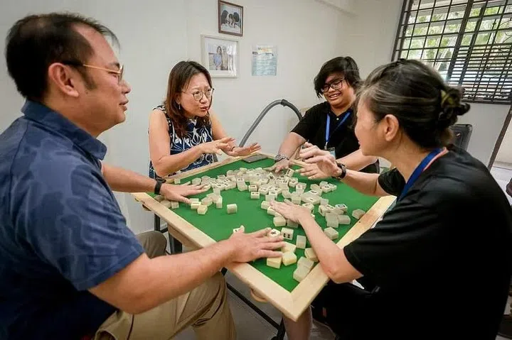 “Neighbours”, who are assigned noise-making roles, playing mahjong at the noise experiential lab. ST PHOTO: GAVIN FOO
