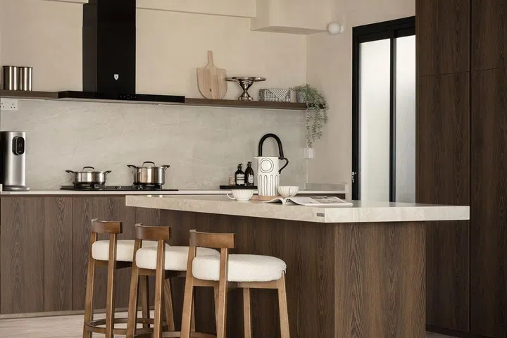 Kitchen island in this 5-room resale HDB in Edgedale Plains' Wabi-Sabi interior design theme.