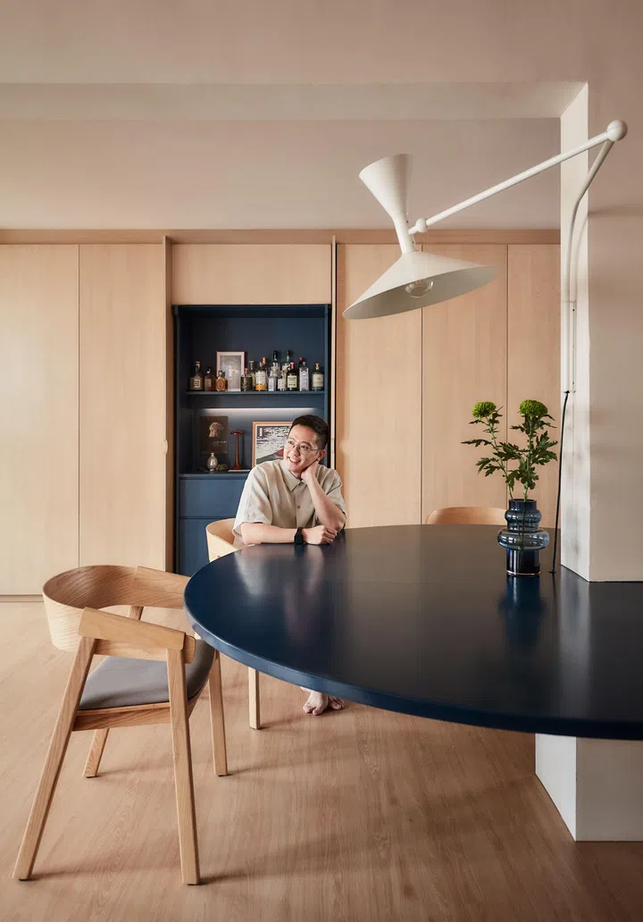 Mounted on the column and hovering above the table is a Le Corbusier Lampe de Marseille wall lamp.