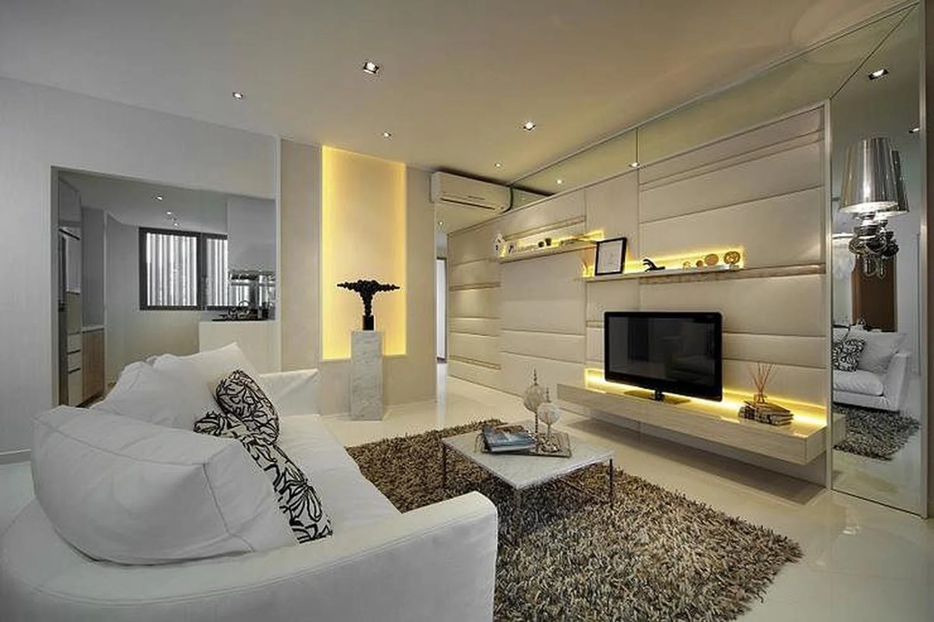 All white living room in an Eight Courtyards condominium, designed by Haire Living.