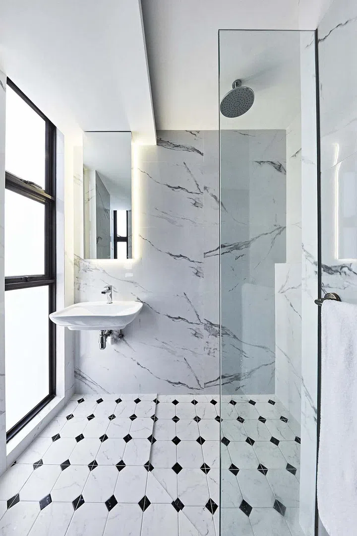 white-themed bathroom with large-slab marble