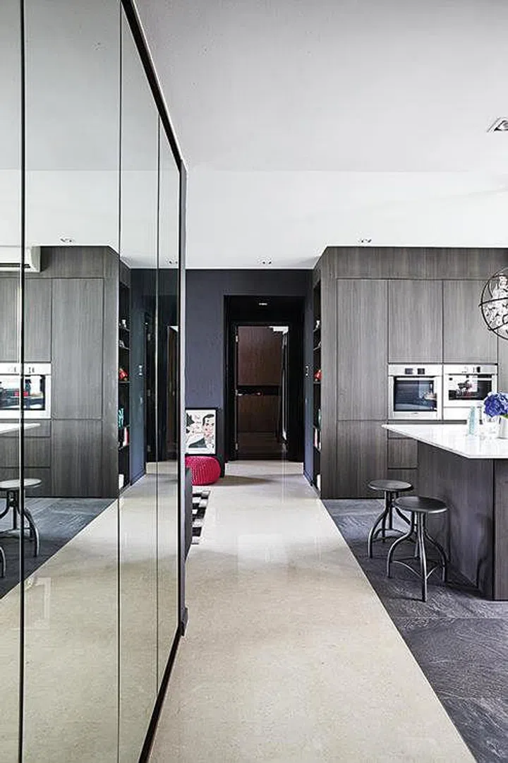 The different types of flooring - marble and tiled - help to delineate the dining and living spaces.