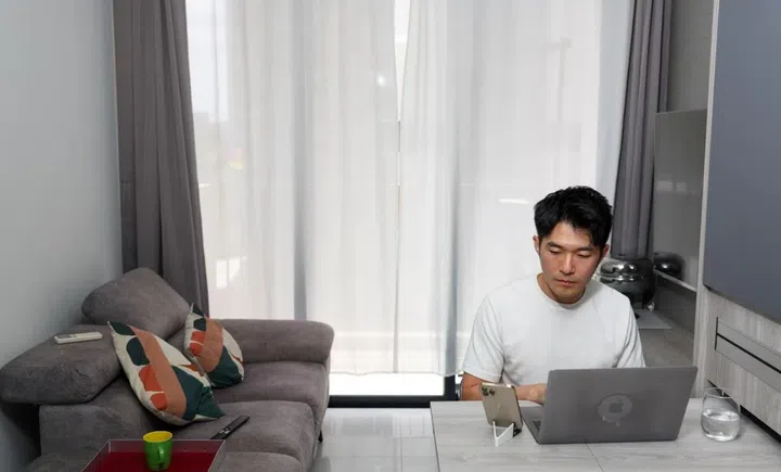 As he has no dining table, Mr Jon Phua eats at a desk that doubles as his workspace.