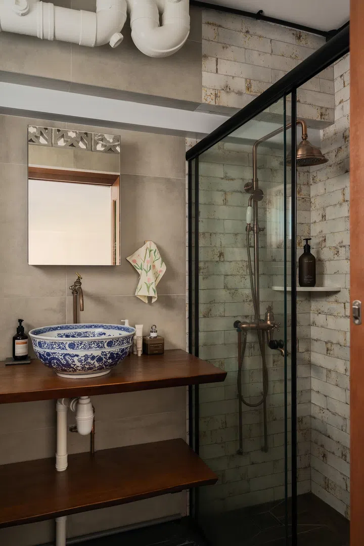 Mixed materials are used throughout the bathroom.