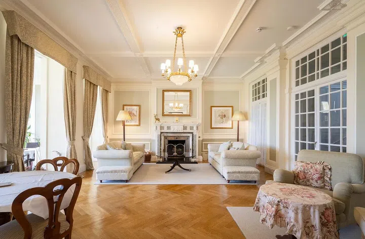 Multiple entertaining rooms feature marble fireplaces.