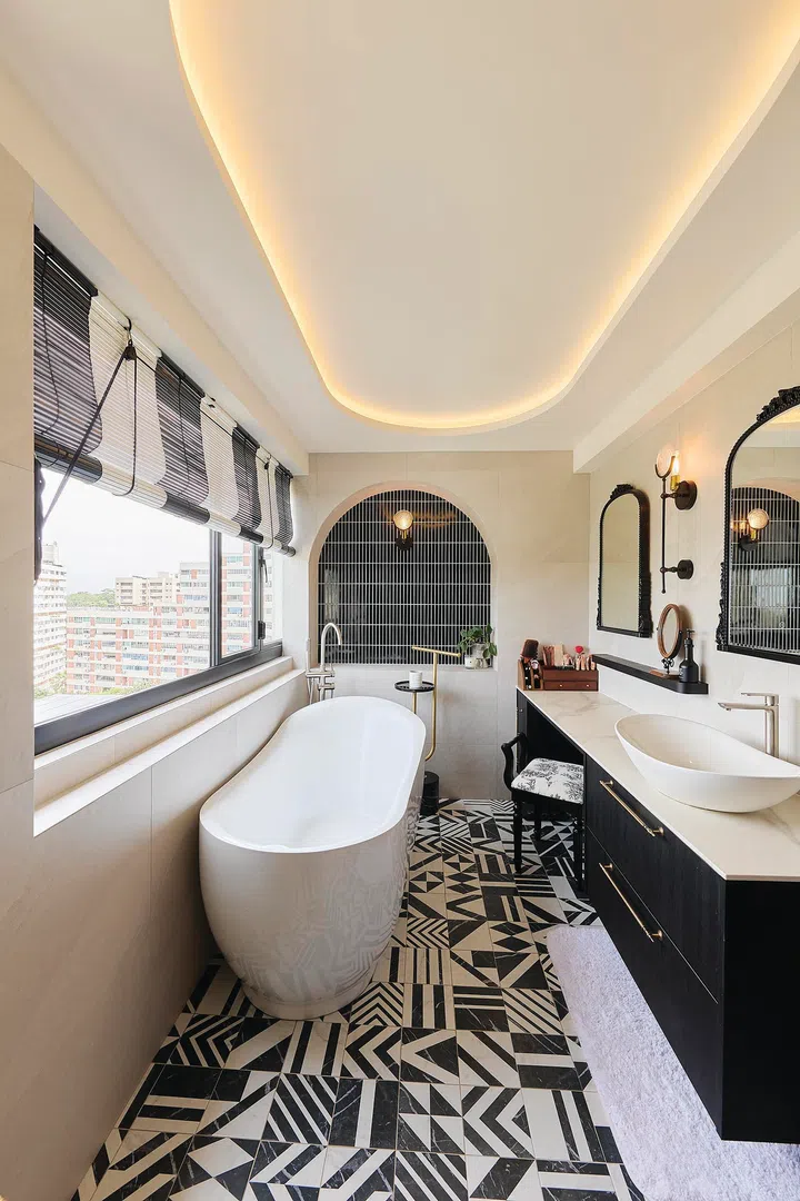 Master bathroom with a freestanding bathtub in a 3-bedroom condo (1,800 sq ft) in Pandan Valley, designed by Insight.Out Studio.