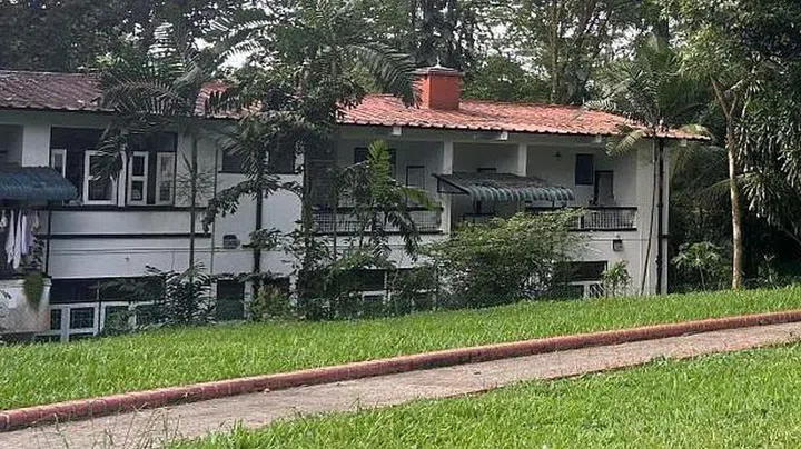 One of two 2-story blocks on the right side of the street. The terrain of Jalan Hang Jebat is uneven and hilly, and the first level of these buildings are a short flight of stairs down.