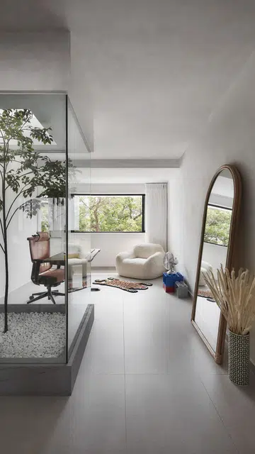 The glass skylight creates privacy for the living room in this 1,367 sq ft 5-room HDB at Bedok Reservoir Road. 