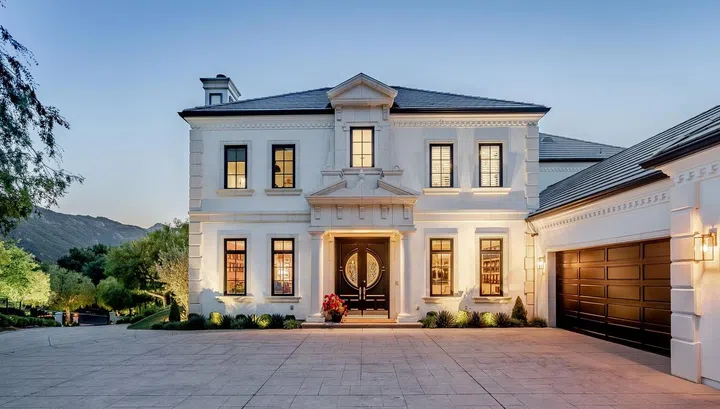 The stately, French-inspired residence sits on one of the country club's largest lots.