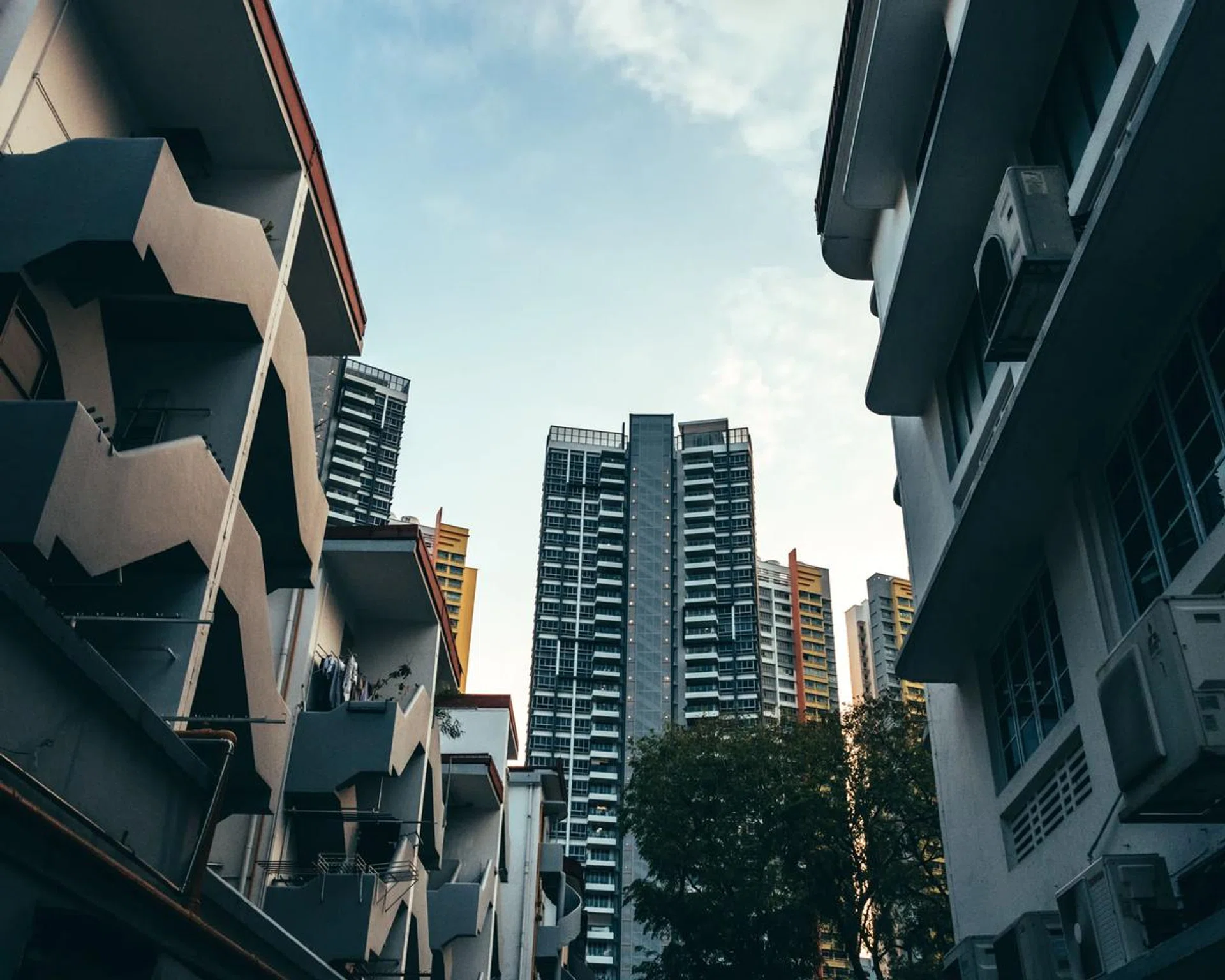 Urban alley in Singapore with moody feel comparing the old and new buildings and architecture. Image from 123RF